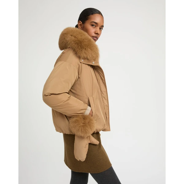 Woman wearing Yves Salomon shearling fur coat – luxury outerwear at Coveti