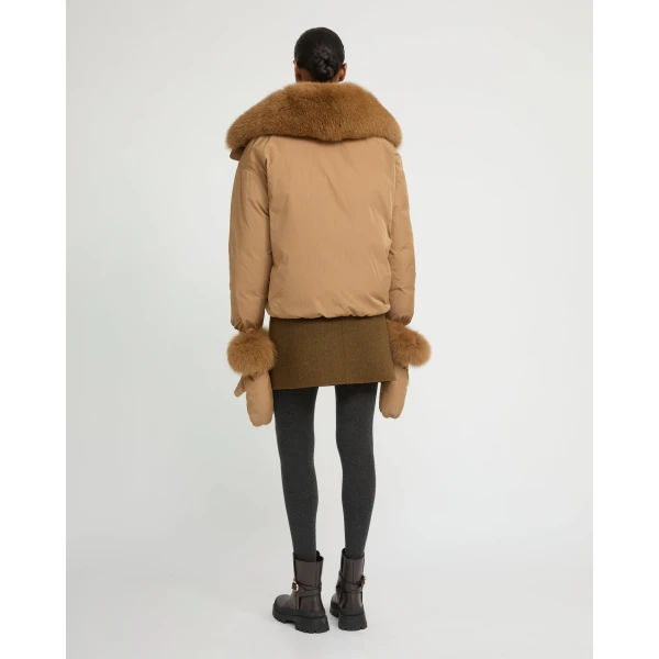 Woman wearing Yves Salomon shearling fur coat – luxury outerwear at Coveti