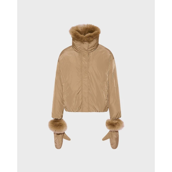 Woman wearing Yves Salomon shearling fur coat – luxury outerwear at Coveti