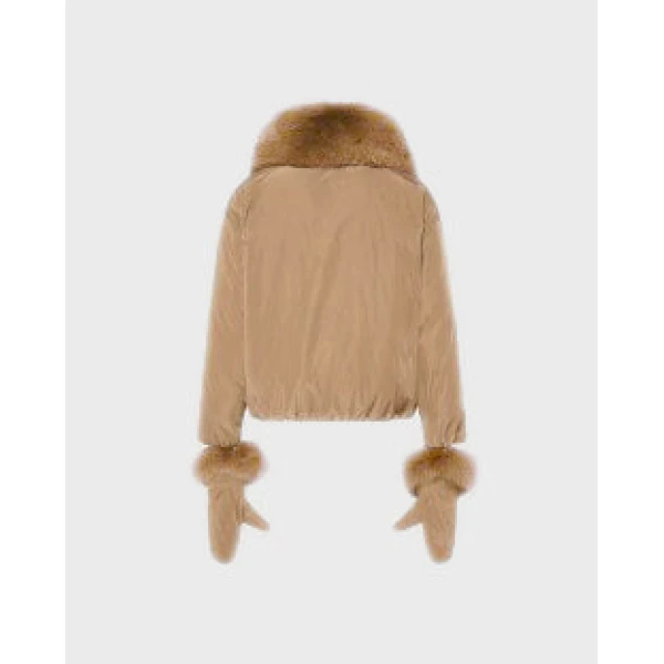 Woman wearing Yves Salomon shearling fur coat – luxury outerwear at Coveti