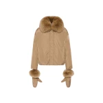 Woman wearing Yves Salomon shearling fur coat – luxury outerwear at Coveti