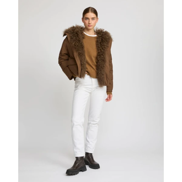 Woman wearing Yves Salomon shearling fur coat – luxury outerwear at Coveti