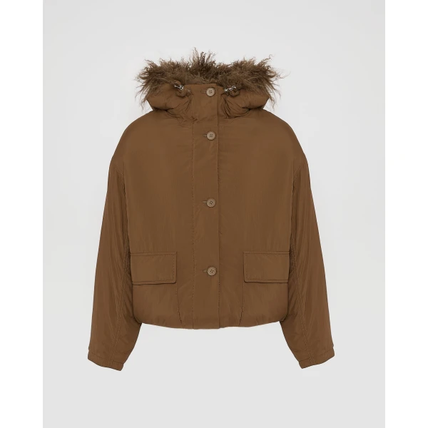 Woman wearing Yves Salomon shearling fur coat – luxury outerwear at Coveti