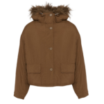 Woman wearing Yves Salomon shearling fur coat – luxury outerwear at Coveti