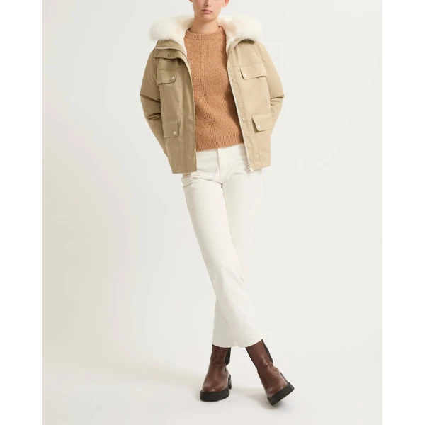 Woman wearing Yves Salomon shearling fur coat – luxury outerwear at Coveti
