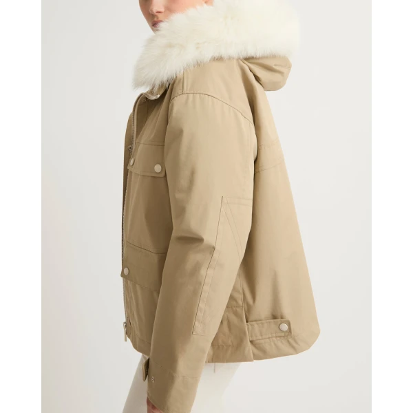 Woman wearing Yves Salomon shearling fur coat – luxury outerwear at Coveti