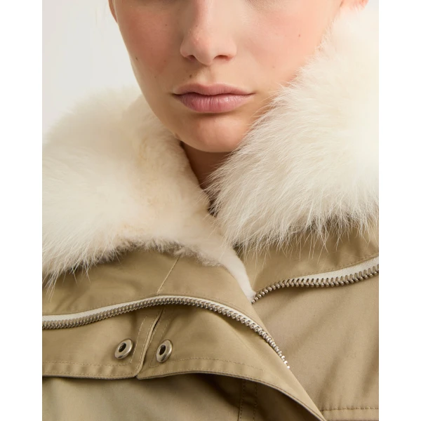 Woman wearing Yves Salomon shearling fur coat – luxury outerwear at Coveti