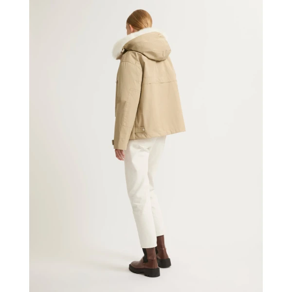 Woman wearing Yves Salomon shearling fur coat – luxury outerwear at Coveti