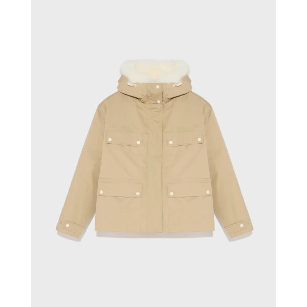 Woman wearing Yves Salomon shearling fur coat – luxury outerwear at Coveti