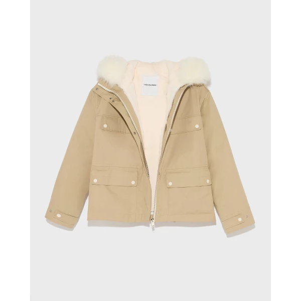 Woman wearing Yves Salomon shearling fur coat – luxury outerwear at Coveti