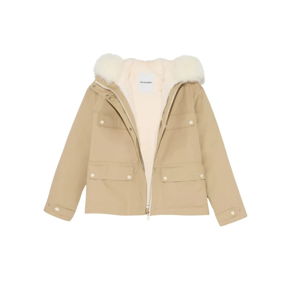 Woman wearing Yves Salomon shearling fur coat – luxury outerwear at Coveti