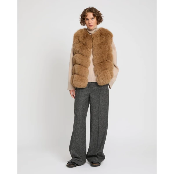 Woman wearing Yves Salomon shearling fur coat – luxury outerwear at Coveti