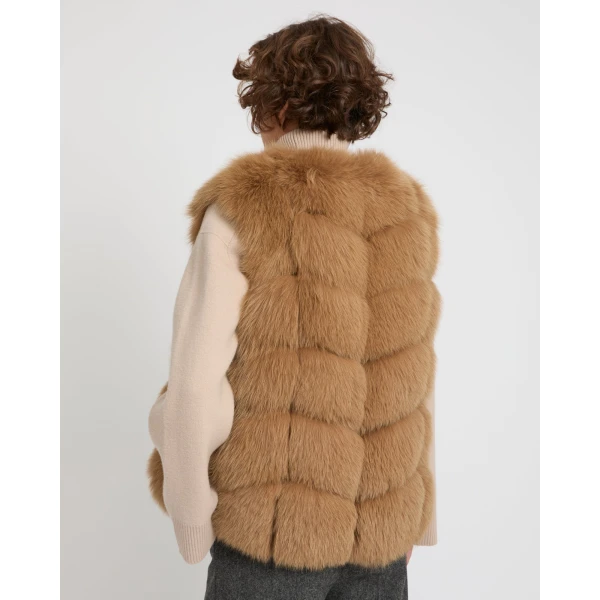 Woman wearing Yves Salomon shearling fur coat – luxury outerwear at Coveti
