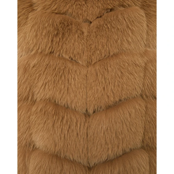 Woman wearing Yves Salomon shearling fur coat – luxury outerwear at Coveti