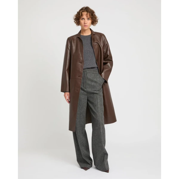 Woman wearing Yves Salomon shearling fur coat – luxury outerwear at Coveti