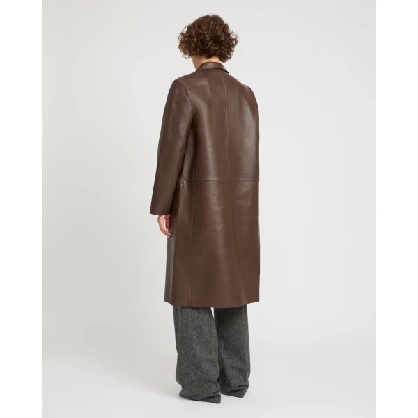 Woman wearing Yves Salomon shearling fur coat – luxury outerwear at Coveti