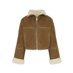 Woman wearing Yves Salomon shearling fur coat – luxury outerwear at Coveti