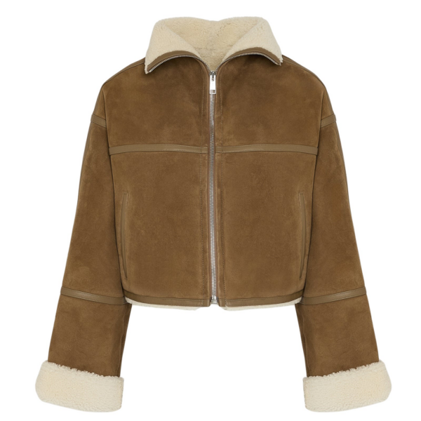 Woman wearing Yves Salomon shearling fur coat – luxury outerwear at Coveti