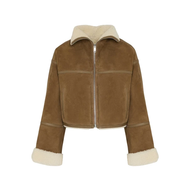 Woman wearing Yves Salomon shearling fur coat – luxury outerwear at Coveti