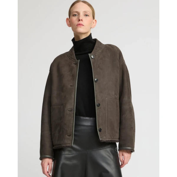 Woman wearing Yves Salomon shearling fur coat – luxury outerwear at Coveti