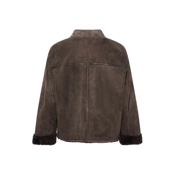 Woman wearing Yves Salomon shearling fur coat – luxury outerwear at Coveti