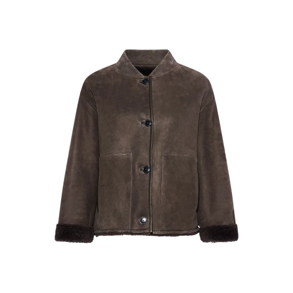 Woman wearing Yves Salomon shearling fur coat – luxury outerwear at Coveti