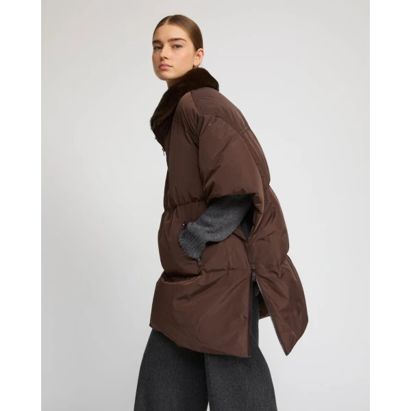 Woman wearing Yves Salomon shearling fur coat – luxury outerwear at Coveti