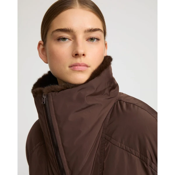 Woman wearing Yves Salomon shearling fur coat – luxury outerwear at Coveti