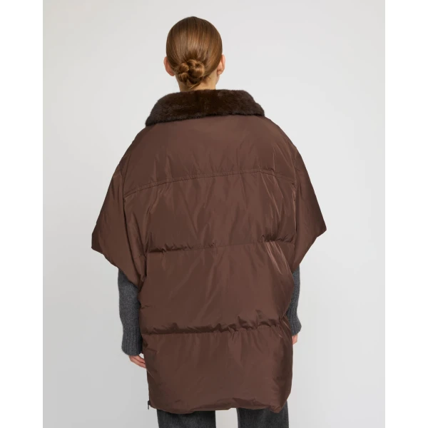 Woman wearing Yves Salomon shearling fur coat – luxury outerwear at Coveti