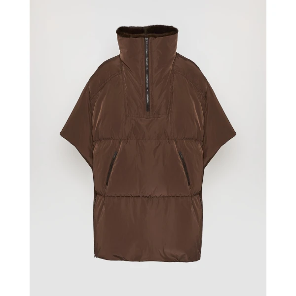 Woman wearing Yves Salomon shearling fur coat – luxury outerwear at Coveti