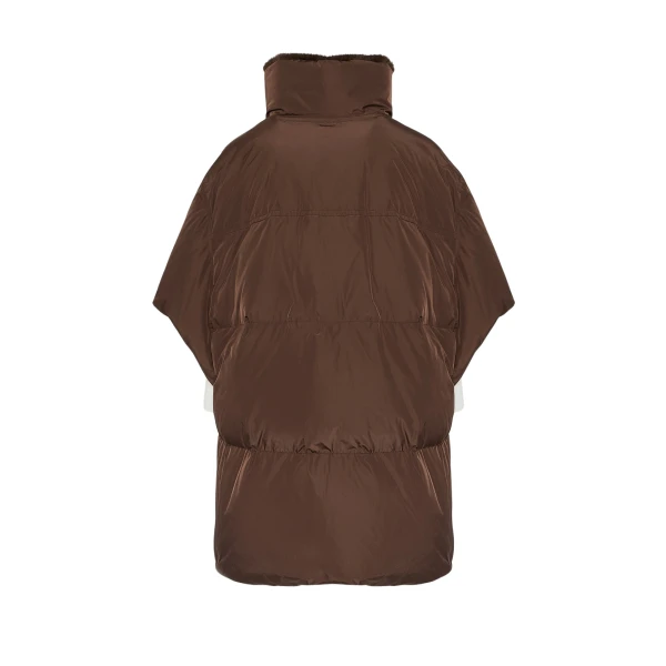 Woman wearing Yves Salomon shearling fur coat – luxury outerwear at Coveti
