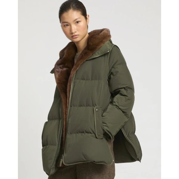 Woman wearing Yves Salomon shearling fur coat – luxury outerwear at Coveti