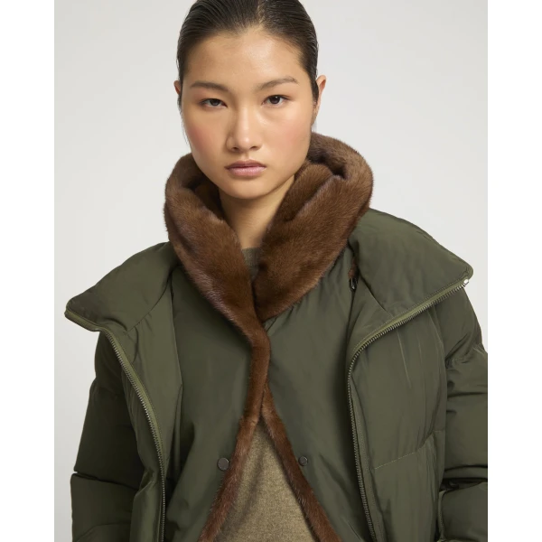 Woman wearing Yves Salomon shearling fur coat – luxury outerwear at Coveti