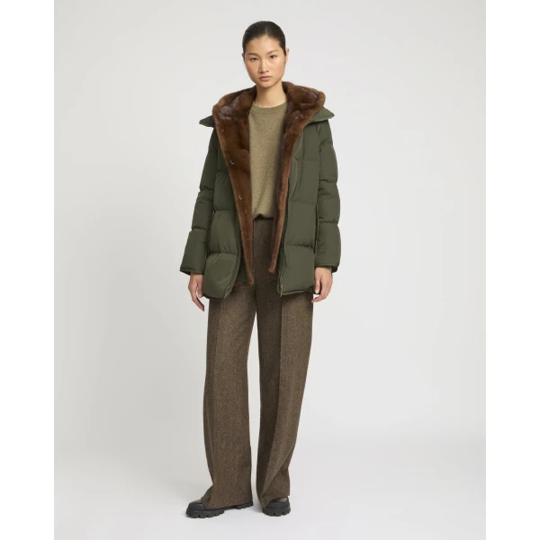 Woman wearing Yves Salomon shearling fur coat – luxury outerwear at Coveti