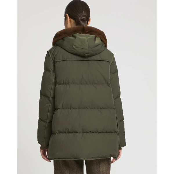 Woman wearing Yves Salomon shearling fur coat – luxury outerwear at Coveti