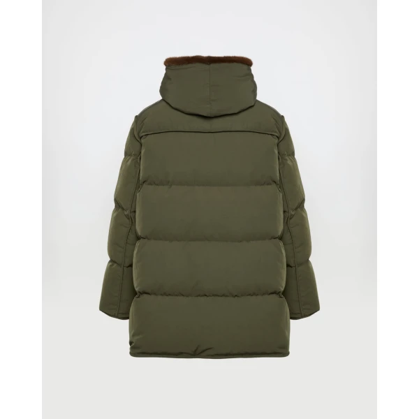 Woman wearing Yves Salomon shearling fur coat – luxury outerwear at Coveti