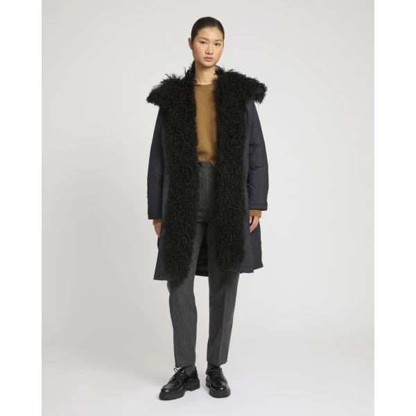 Woman wearing Yves Salomon shearling fur coat – luxury outerwear at Coveti