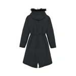 Woman wearing Yves Salomon shearling fur coat – luxury outerwear at Coveti