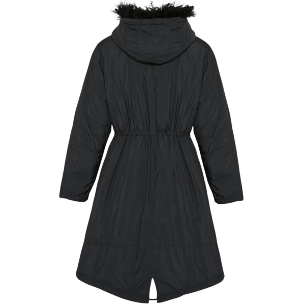 Woman wearing Yves Salomon shearling fur coat – luxury outerwear at Coveti