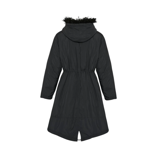 Woman wearing Yves Salomon shearling fur coat – luxury outerwear at Coveti