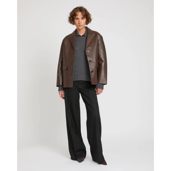 Woman wearing Yves Salomon shearling fur coat – luxury outerwear at Coveti
