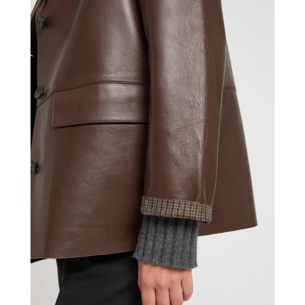 Woman wearing Yves Salomon shearling fur coat – luxury outerwear at Coveti