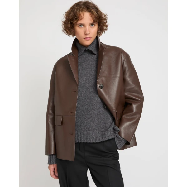 Woman wearing Yves Salomon shearling fur coat – luxury outerwear at Coveti