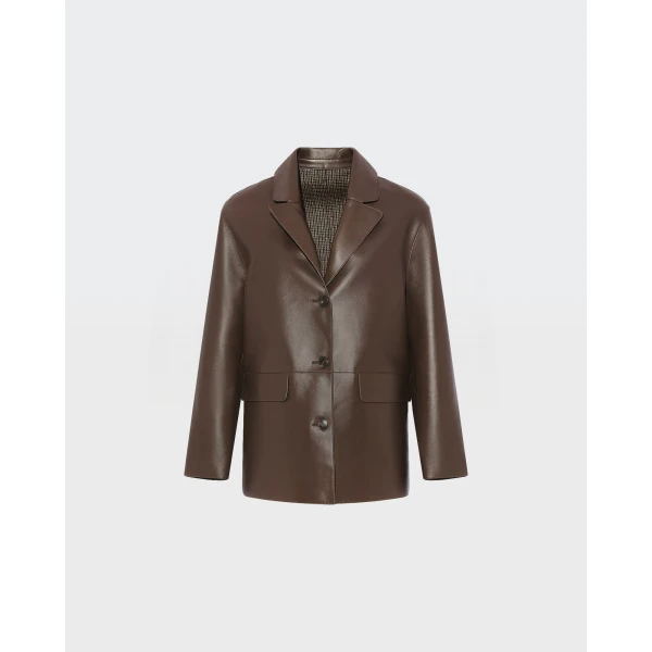 Woman wearing Yves Salomon shearling fur coat – luxury outerwear at Coveti