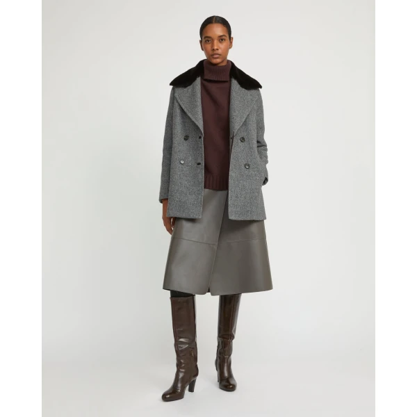 Woman wearing Yves Salomon shearling fur coat – luxury outerwear at Coveti