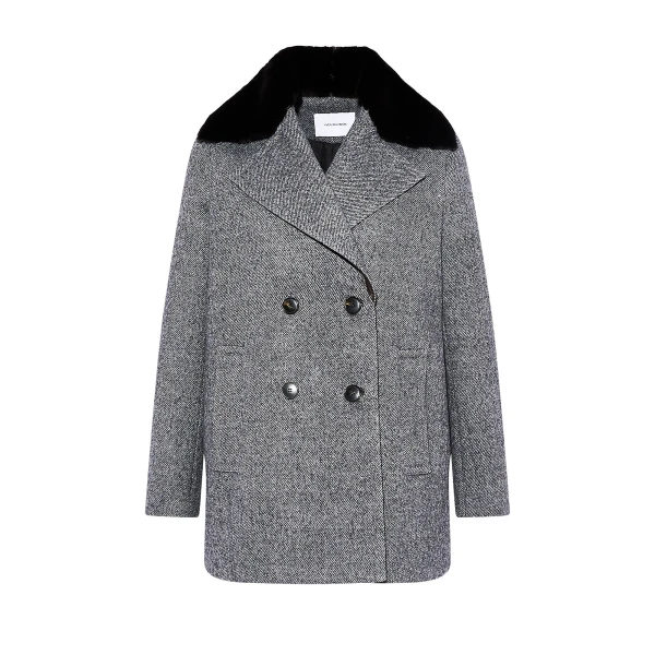 Woman wearing Yves Salomon shearling fur coat – luxury outerwear at Coveti
