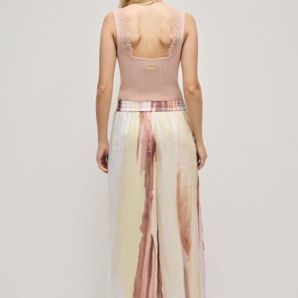 Aje Aus  – structured silhouette with raw femininity from Coveti