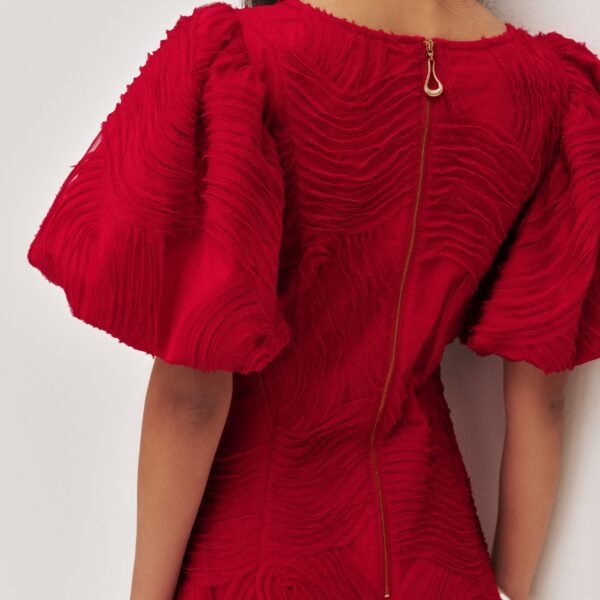 Aje Aus Dresses – structured silhouette with raw femininity from Coveti