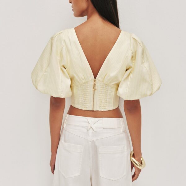 Aje Aus Tops – structured silhouette with raw femininity from Coveti