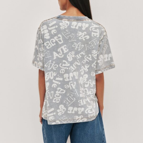 Aje Aus Tops – structured silhouette with raw femininity from Coveti